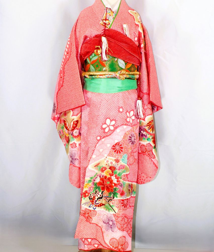 Pink shibori children's kimono with butterflies and flower bouquets