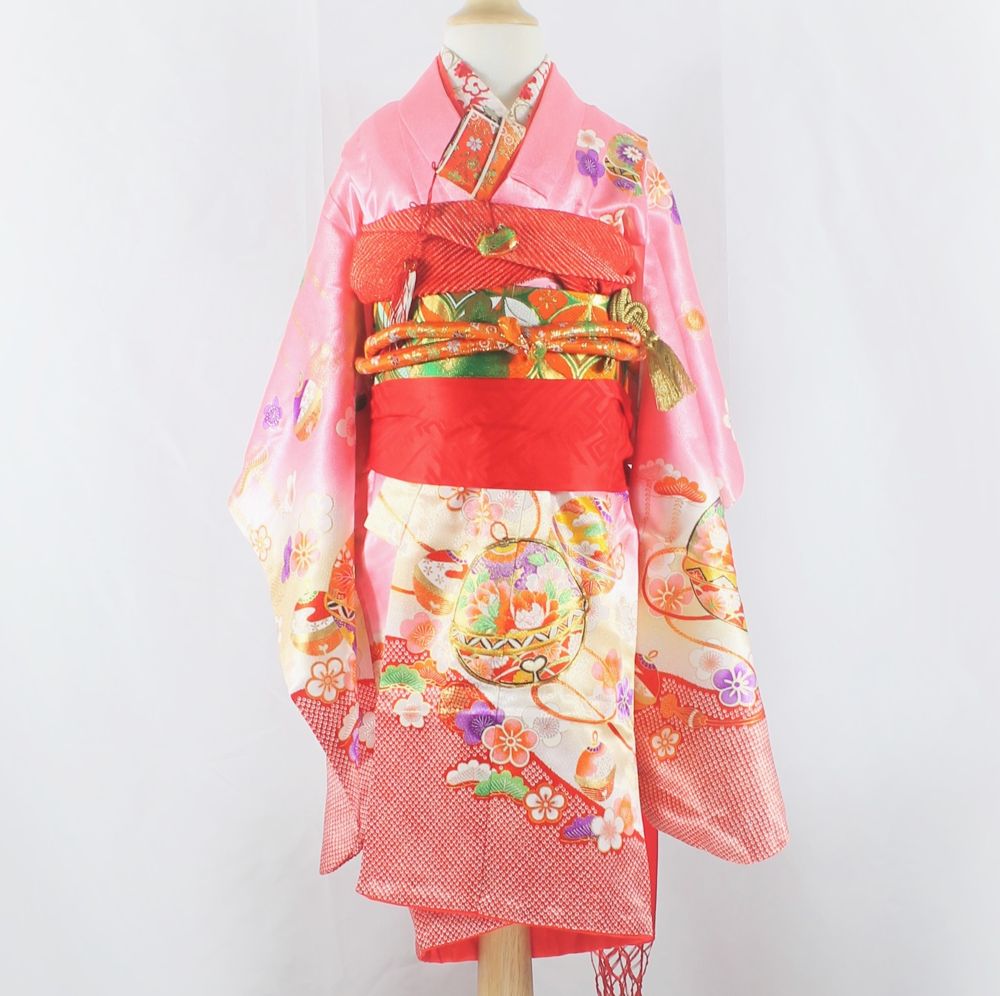 Pink children's kimono with temari balls and plum blossoms
