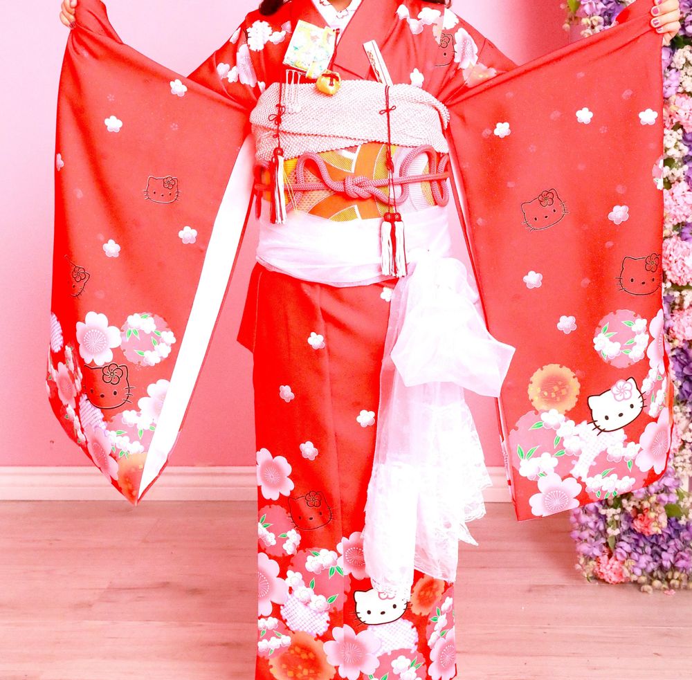 Red children's kimono with cherry blossoms and character print